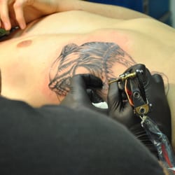 Anarchy Ink Tattoos - Same Dinosaur on the ribs.