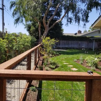D A Landscape Services - a fenced in yard - Tree Services Near Me