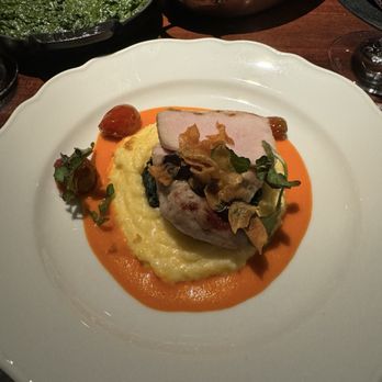 Bludorn - Roasted pork loin with polenta, Swiss chard and cherry tomato - New American Near Me - Houston, Texas Bludorn - Roasted pork loin with polenta, Swiss chard and cherry tomato - New American Near Me - Houston, Texas