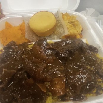 Oley's Kitchen & BBQ - Oxtail with yellow rice, yams, mac n cheese, & cornbread. Best combo was the yellow rice and oxtail/oxtail sauce. - Soul Food Near Me - Orlando, Florida Oley's Kitchen & BBQ - Oxtail with yellow rice, yams, mac n cheese, & cornbread. Best combo was the yellow rice and oxtail/oxtail sauce. - Soul Food Near Me - Orlando, Florida