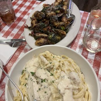 Buca di Beppo Italian Restaurant - Fettuccine Alfredo next to Brussel Sprouts with Prosciutto - Italian Near Me - Universal City, California