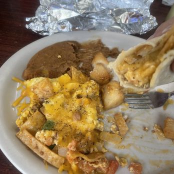 Losoya's Taqueria - Half eaten migas and a taco I made. - Mexican Near Me - San Antonio, Texas Losoya's Taqueria - Half eaten migas and a taco I made. - Mexican Near Me - San Antonio, Texas