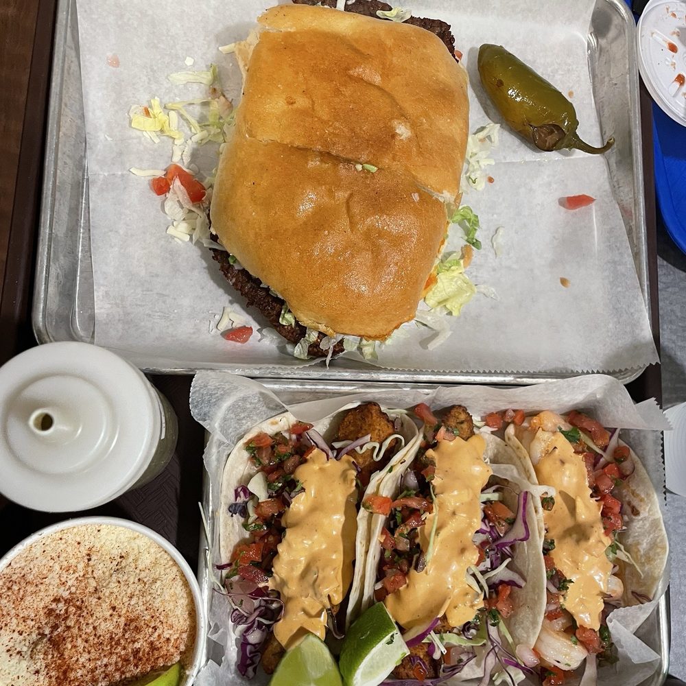 The Taqueria - Torta milanesa and fish and shrimp tacos with a side of elotes - Desserts Near Me - De Pere, Wisconsin The Taqueria - Torta milanesa and fish and shrimp tacos with a side of elotes - Desserts Near Me - De Pere, Wisconsin