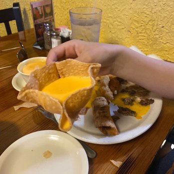El Corral Mexican Restaurant - a person grabbing a sandwich from a plate - Mexican Near Me - Buffalo, Texas El Corral Mexican Restaurant - a person grabbing a sandwich from a plate - Mexican Near Me - Buffalo, Texas