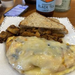 Mushroom omelette. Toast and home-fries.