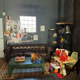 A kid's corner with toys and books- perfect for families!