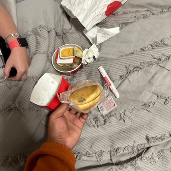 Chick-fil-A - ows a person sitting on a bed eating a sandwich - Fast Food Near Me - Huntsville, Texas Chick-fil-A - ows a person sitting on a bed eating a sandwich - Fast Food Near Me - Huntsville, Texas