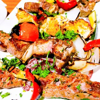 Arabian Nights Restaurant - a plate of grilled meat and vegetables - Mediterranean Near Me - San Francisco, California