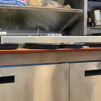 Waffle House - a waffle machine in a kitchen - Diners Near Me - Shepherdsville, Kentucky