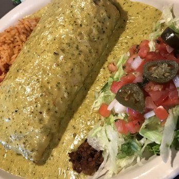 Chuy's - As Big as Yo Face Burrito: Season ground sirloin, retired beans, & cheese filling covered in Boom Boom Sauce - Tex-Mex Near Me - Jacksonville, Florida