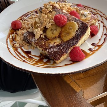 The Ledge - Cape Toast (French Toast with toasted almonds, bananas, and raspberries) - American Near Me - Cabo San Lucas, BCS The Ledge - Cape Toast (French Toast with toasted almonds, bananas, and raspberries) - American Near Me - Cabo San Lucas, BCS