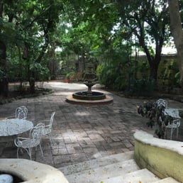 Loving the quiet shady patio in back.  Super friendly folks giving us directions and recommendations for our first trip to Cozumel.