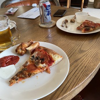BC Pizza - two plates of pizza and a beer - Pizza Near Me - Boyne City, Michigan