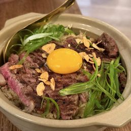 Khao pad man nuer (beef tallow fried rice topped with ribeye and egg yolk) - sooo good Khao pad man nuer (beef tallow fried rice topped with ribeye and egg yolk) - sooo good