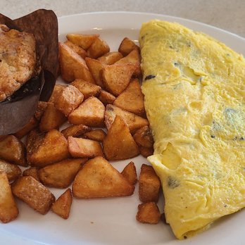Wild Eggs - Make Your Own 4 Egg Omelette served with potatoes and blue Berry muffins. - Breakfast & Brunch Near Me - Carmel, Indiana Wild Eggs - Make Your Own 4 Egg Omelette served with potatoes and blue Berry muffins. - Breakfast & Brunch Near Me - Carmel, Indiana