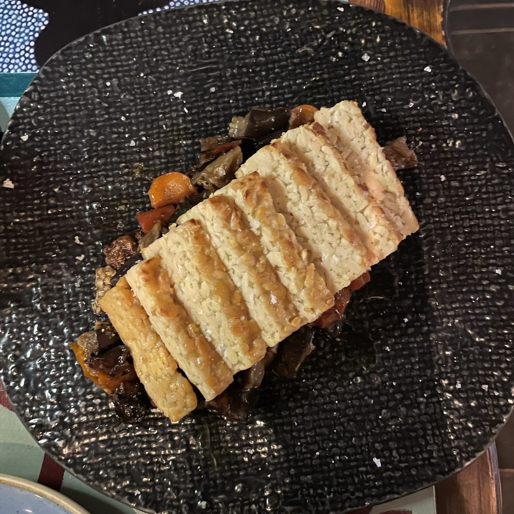 Tempeh over roasted tomatoes and eggplant. Tempeh over roasted tomatoes and eggplant.