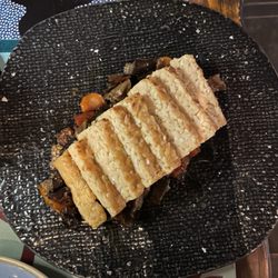 Timoty Drinks & kitchen - Tempeh over roasted tomatoes and eggplant.