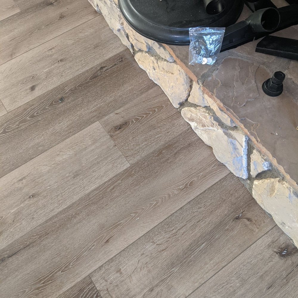 Gonzalez Floor Installations - They cut stone so flooring slides under flush. - Flooring Near Me