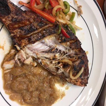 Gorée Cuisine - Red snapper 1/4 eaten (sorry cannot wait) - Senegalese Near Me - Chicago, Illinois Gorée Cuisine - Red snapper 1/4 eaten (sorry cannot wait) - Senegalese Near Me - Chicago, Illinois