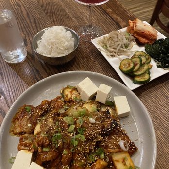 Mandu - Duru Jjigee Gochujang-marinated pork belly seared with kimchi and rice cakes, with steamed tofu - Korean Near Me - Washington, DC, District of Columbia Mandu - Duru Jjigee Gochujang-marinated pork belly seared with kimchi and rice cakes, with steamed tofu - Korean Near Me - Washington, DC, District of Columbia