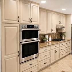 Pacific Kitchens Inc - Refaced by Pacific Kitchens in select white maple painted "Canvas Tan".