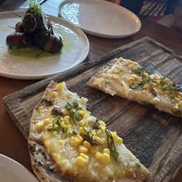 Corn and truffle flatbread w/ bacon wrapped dates. Corn and truffle flatbread w/ bacon wrapped dates.