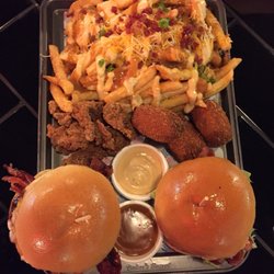 Milky Lane Surfers Paradise - ultimate platter. 2 burgers, popKorn chicken, 3 croquettes, dirty fries and dipping sauces,unlimited soda for two and a thick shake