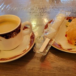 Pomona Cafe - My $99.40 purchase of coffee and a roll.