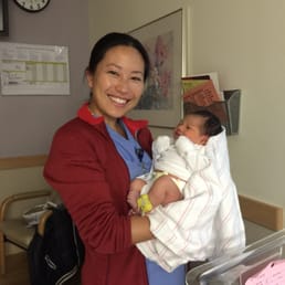 Dr. Teng visiting me and the baby at the hospital (bright and early) the day following my delivery. Dr. Teng visiting me and the baby at the hospital (bright and early) the day following my delivery.