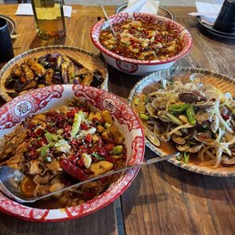 Sautéed Eggplant in spicy garlic sauce, stir fried taro + bone-in chicken, Sichuan boiling fish, and stir-fried chili clams Sautéed Eggplant in spicy garlic sauce, stir fried taro + bone-in chicken, Sichuan boiling fish, and stir-fried chili clams