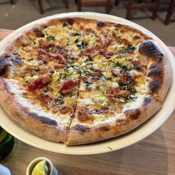 Sixty Vines - White sauce bacon, sun dried tomatoes perfectly baked - Pizza Near Me - Raleigh, North Carolina Sixty Vines - White sauce bacon, sun dried tomatoes perfectly baked - Pizza Near Me - Raleigh, North Carolina