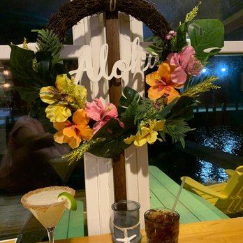 Tres Palms - a table with drinks and a wreath - New American Near Me - Babylon, New York