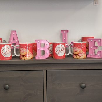 Sable Shortbread - a shelf with coffee mugs and doughnuts - Bakeries Near Me - Windsor, Nova Scotia Sable Shortbread - a shelf with coffee mugs and doughnuts - Bakeries Near Me - Windsor, Nova Scotia