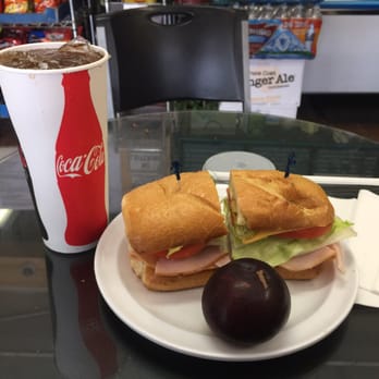 Railroad Stop Deli - Turkey avocado sandwich with a plum on the side - Delis Near Me - Oakland, California