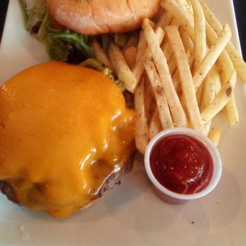 Chalkboard Menu - Green Chile Cheese Burger with fries as it was served on a white platter at Chalkboard Menu. - Burgers Near Me - Las Cruces, New Mexico