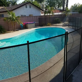 Nathans Pool Fence - Brown posts and brown fence screens. Beautiful and the pool view through it is still amazing! No dirt will be visible neither. Love it! - Fences & Gates Near Me - Brea, California