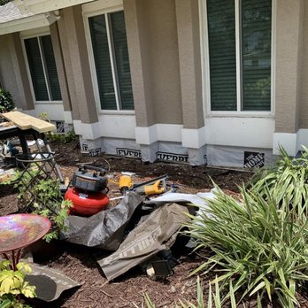 American House Repairs - a lawn mower in front of a house - Fences & Gates Near Me American House Repairs - a lawn mower in front of a house - Fences & Gates Near Me