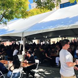 Oktoberfest - Packed tent with various activities n local bands