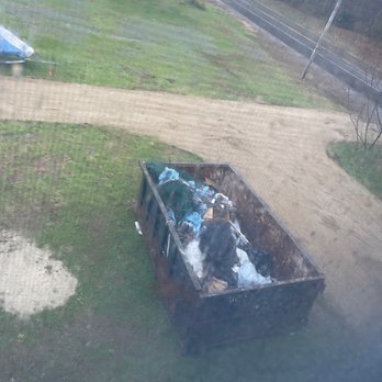 Casella Waste System - Pacing contractor designed driveway around the dumpster that should have been gone. - Junk Removal & Hauling Near Me - Wolfeboro, New Hampshire