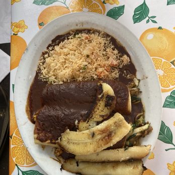 Tune-Up Cafe - Dish dish, vegetable vegetables, bananas on top Mole Colorado Enchiladas - New Mexican Cuisine Near Me - Santa Fe, New Mexico