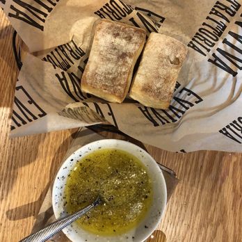 Evviva Trattoria - Dipping oil that i doctored with up grated Parmesan salt, red peppered flakes. - Pizza Near Me - Wrentham, Massachusetts