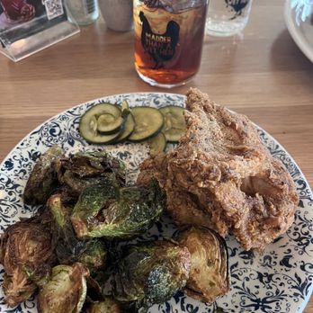 Tupelo Honey - Honey-dusted bone-in fried chicken with salt and pepper brussel sprouts - Southern Near Me - Omaha, Nebraska Tupelo Honey - Honey-dusted bone-in fried chicken with salt and pepper brussel sprouts - Southern Near Me - Omaha, Nebraska