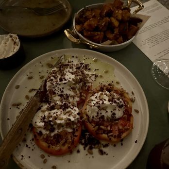 Sawa - heirloom tomato salad with toum, sunflower seeds, and sumac + crispy potatoes - Lebanese Near Me - Brooklyn, New York