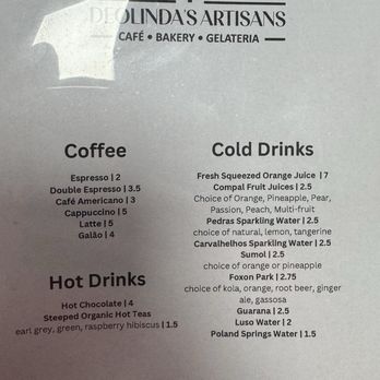 Deolinda's Artisans - Coffee Drinks Menu - Coffee, cold drinks, and hot drinks menu from Deolinda's Artisans, a cafe and bakery in Danbury, CT, listing various beverages and prices. - Portuguese Near Me - Danbury, Connecticut