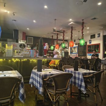 Bistro St Germain - Lights wrapped up in green and red for Christmas - French Near Me - Seal Beach, California Bistro St Germain - Lights wrapped up in green and red for Christmas - French Near Me - Seal Beach, California