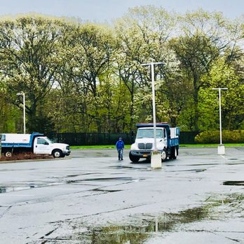 R.J.K. Gardens - a man standing in a parking lot - Landscaping Near Me - Saint James, New York R.J.K. Gardens - a man standing in a parking lot - Landscaping Near Me - Saint James, New York