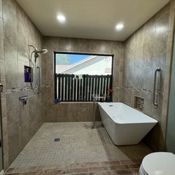 KTW Remodeling - Changed out existing garden tub and made room for new soaker tub and walk in shower.