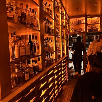 Copper & Oak - people in a bar with bottles of alcohol - Bars Near Me - New York, New York Copper & Oak - people in a bar with bottles of alcohol - Bars Near Me - New York, New York