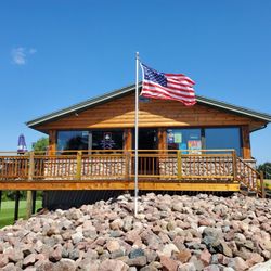 Sunset Hills Golf Course, Driving Range & Miniature Golf Course - The Clubhouse Drinks, pizza, ice cream, and snacks served Relax inside or outside on the deck overlooking the course and miniature course.