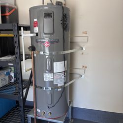 Chris’ Plumbing Services - Electric heat pump water heater installation with drain